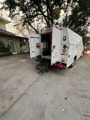 Magnet Plumbing service vehicle on-site for Grease Trap Cleaning in Paradise Park
